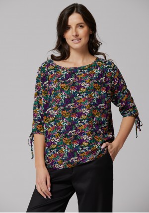 Floral blouse with ties on the sleeves